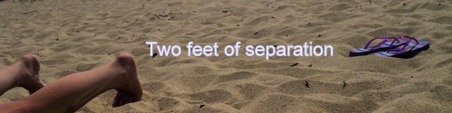 Feet and flip-flops on beach